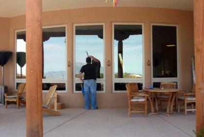 Window cleaner washing windows in Albuquerque